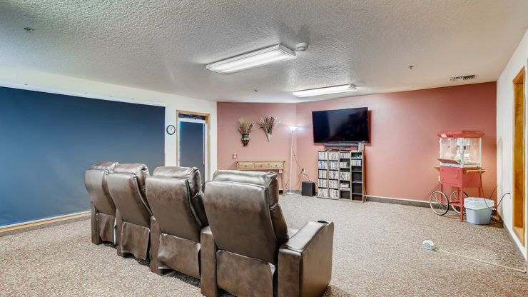 A welcoming lounge with comfortable seating, perfect for movie nights and community gatherings.