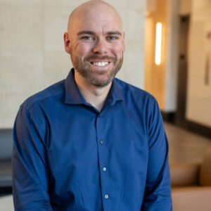 A welcoming atmosphere with a friendly staff member ready to support community connections.