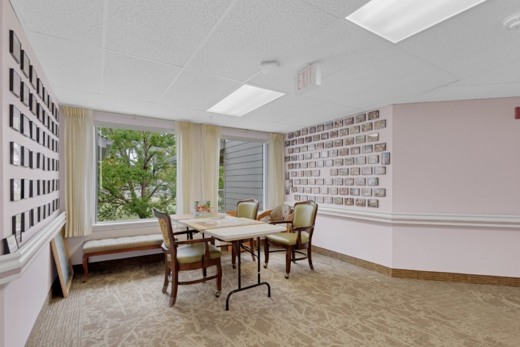 A bright, inviting space with comfortable seating, warm decor, and cherished memories adorning the walls.