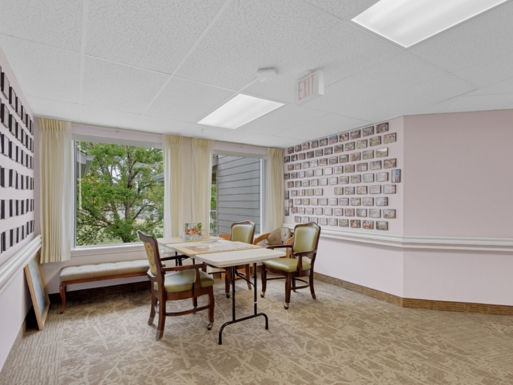 A bright, inviting space with comfortable seating, warm decor, and cherished memories adorning the walls.