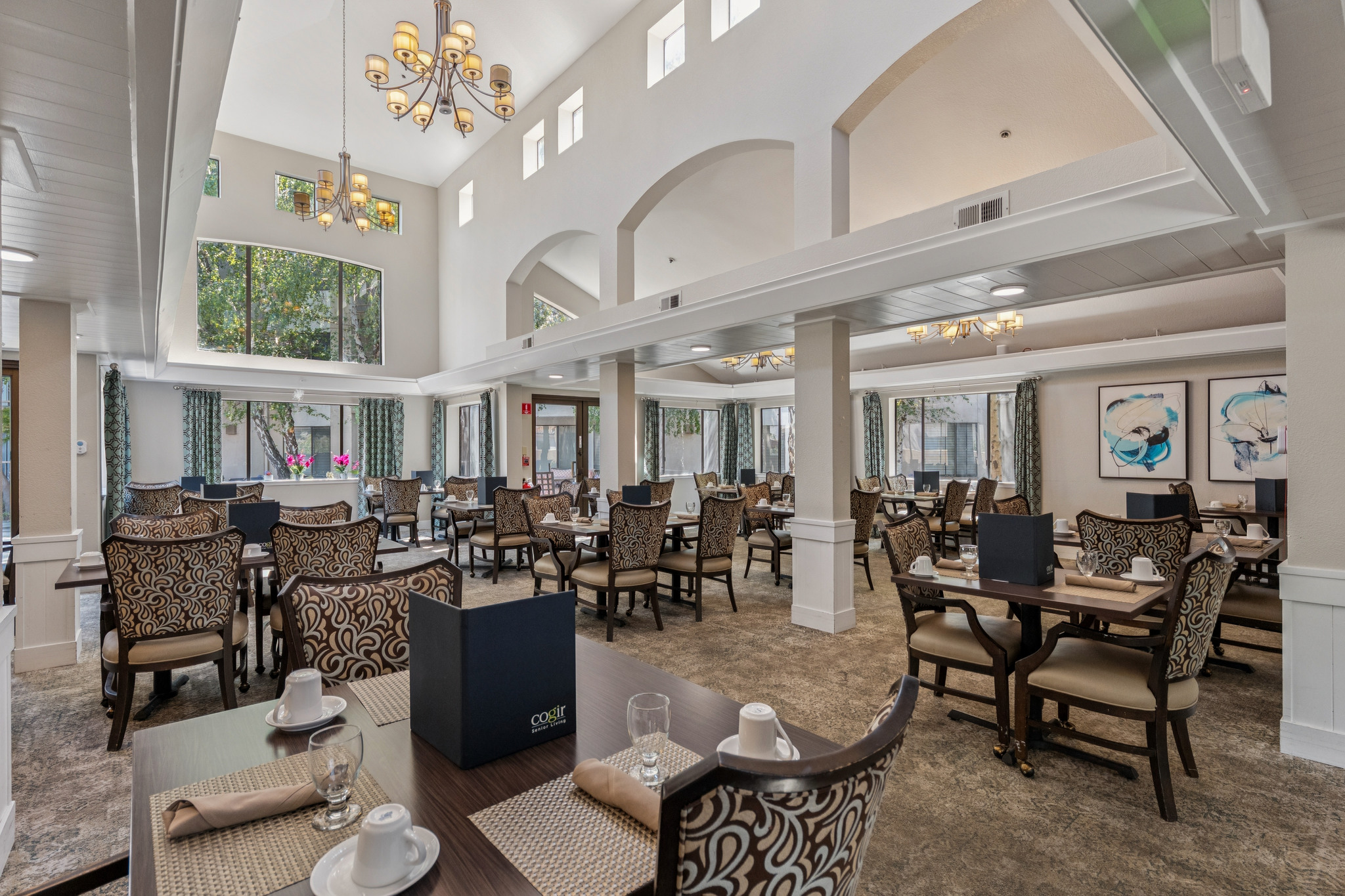 A spacious dining area filled with natural light, inviting residents to enjoy meals and connect.