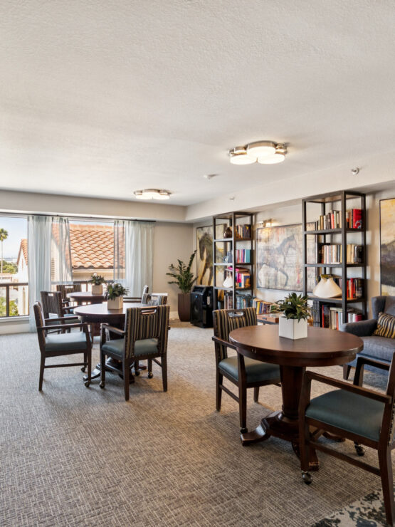 A bright, inviting common area with comfortable seating and vibrant decor, perfect for community gatherings.