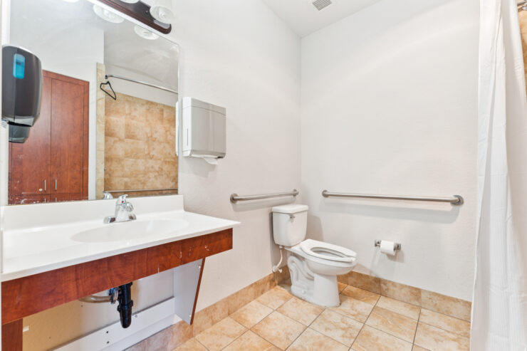 A well-appointed bathroom designed for comfort and accessibility, promoting a welcoming environment.