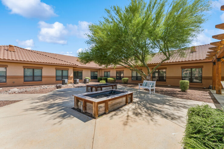 A welcoming courtyard with shaded seating invites community gatherings and relaxation.