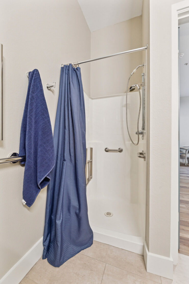 A welcoming bathroom space featuring soft towels, emphasizing comfort and care for residents.