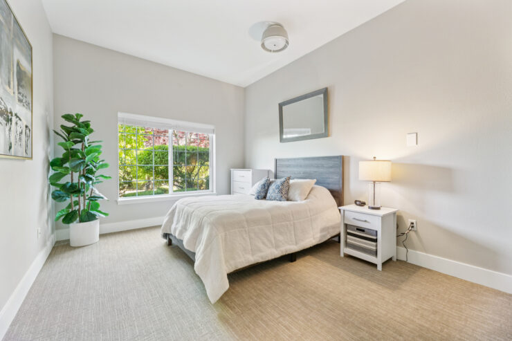 A bright, inviting bedroom with a serene atmosphere, perfect for relaxation and comfort.