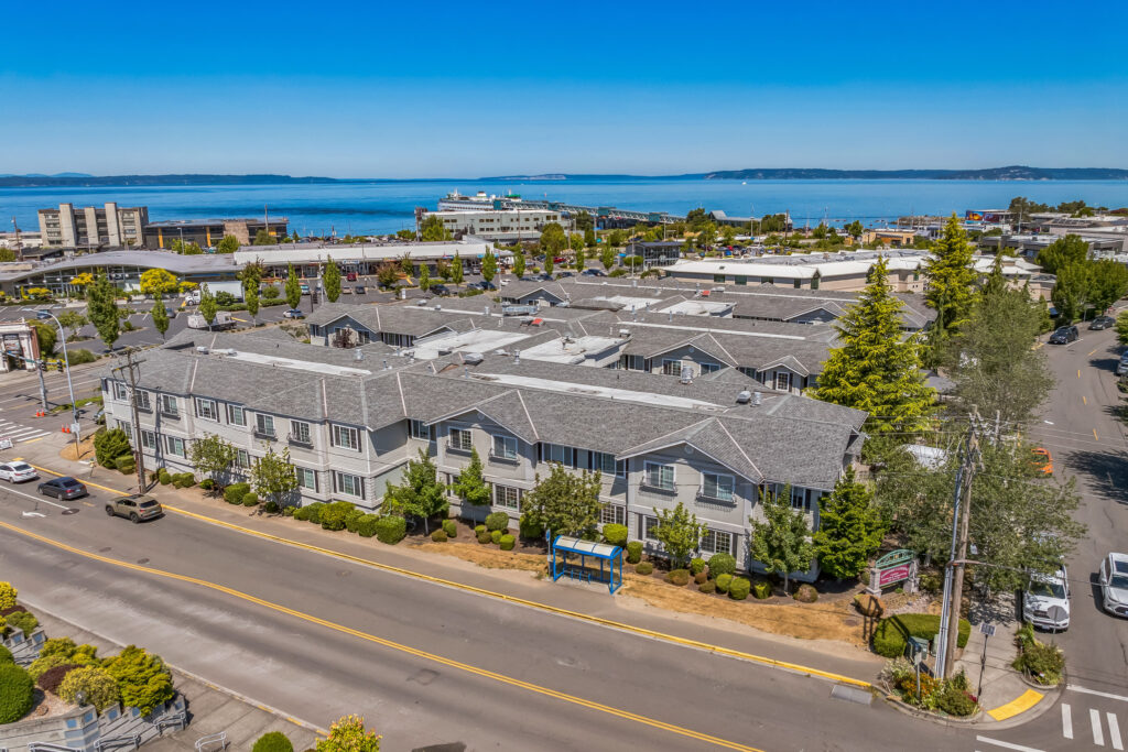 A welcoming community nestled by the water, inviting comfort and connection for all residents.