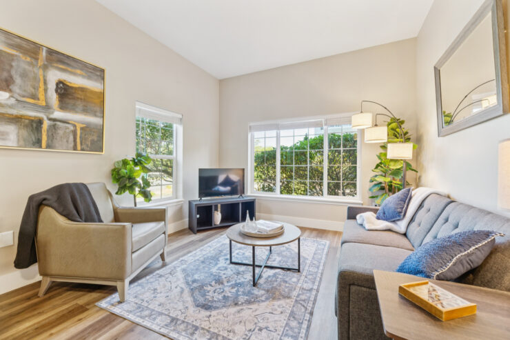 A welcoming living area with natural light, inviting seating, and a warm atmosphere for community gatherings.
