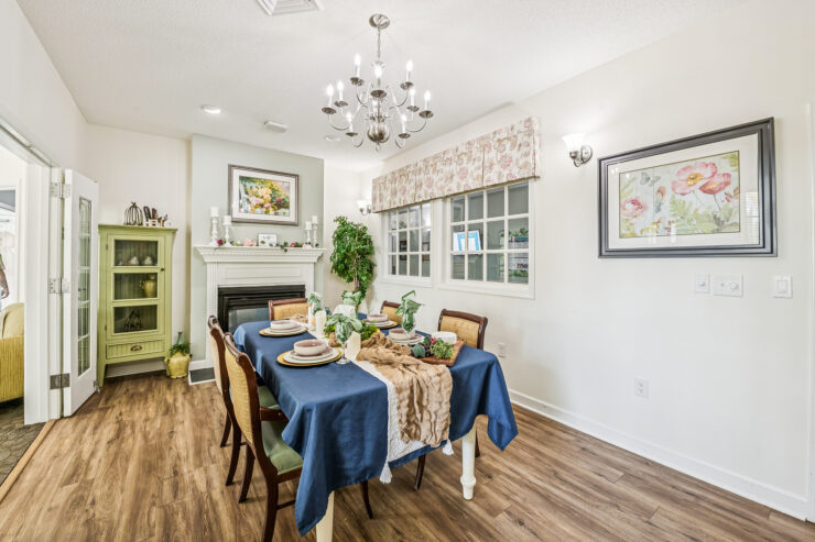 A welcoming dining area with elegant decor, fostering community and warmth for residents.