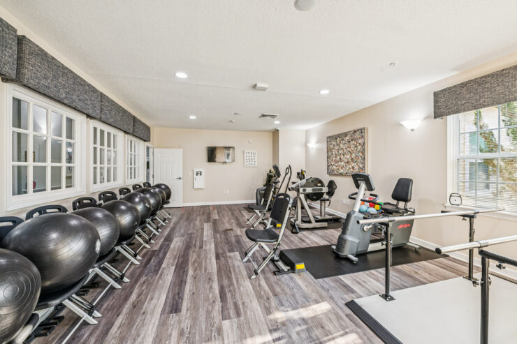 A bright, inviting exercise area featuring modern equipment, fostering community and wellness.