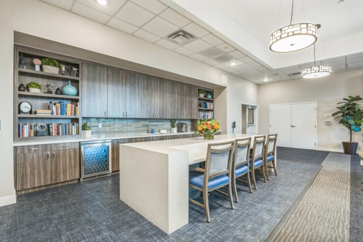A welcoming kitchen space designed for community gatherings, featuring modern amenities and comfortable seating.