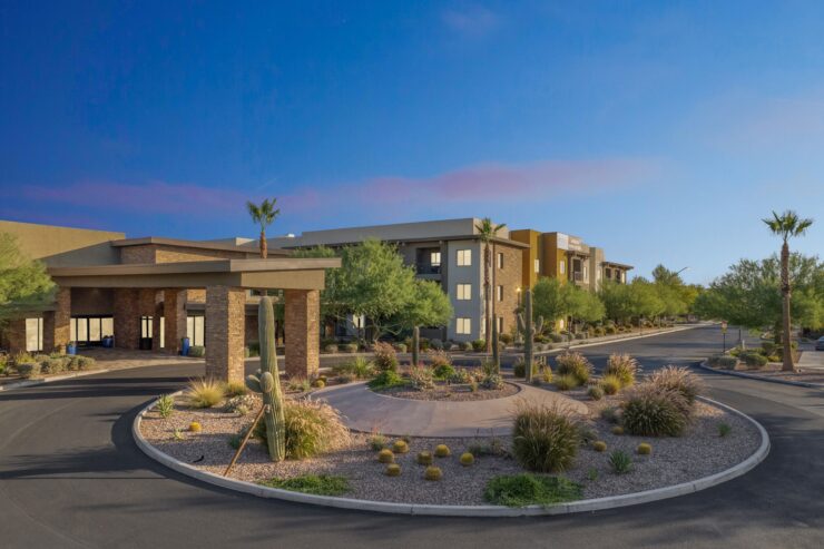 A welcoming retirement community surrounded by serene landscaping, promoting comfort and connection.