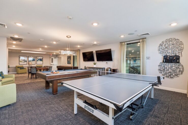 A welcoming activity room featuring table tennis, inviting residents to engage and connect.