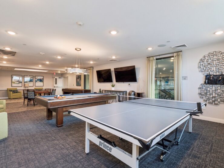A welcoming activity room featuring table tennis, inviting residents to engage and connect.
