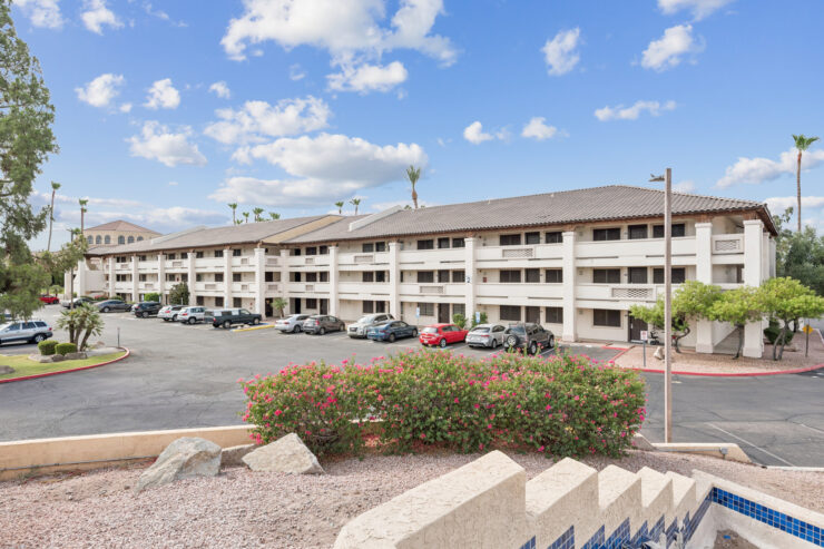 A welcoming community with vibrant landscaping and comfortable living spaces, perfect for relaxation.