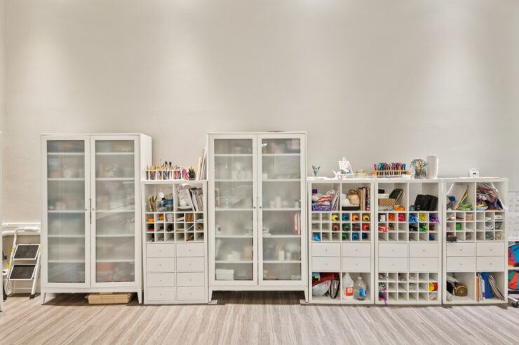 Bright, inviting shelves filled with colorful activities, fostering creativity and community spirit.