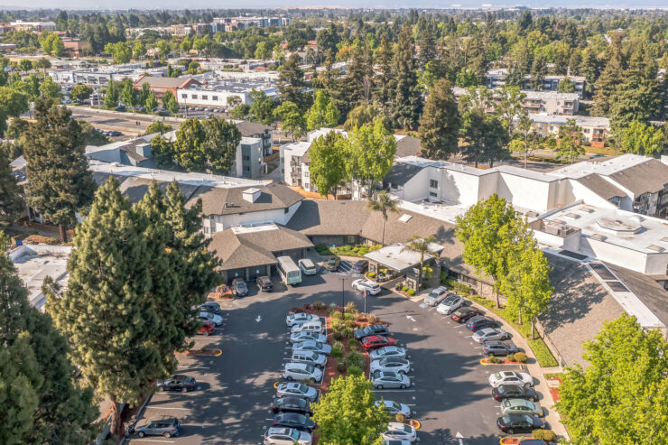 A welcoming community surrounded by greenery, fostering comfort and connection among residents.