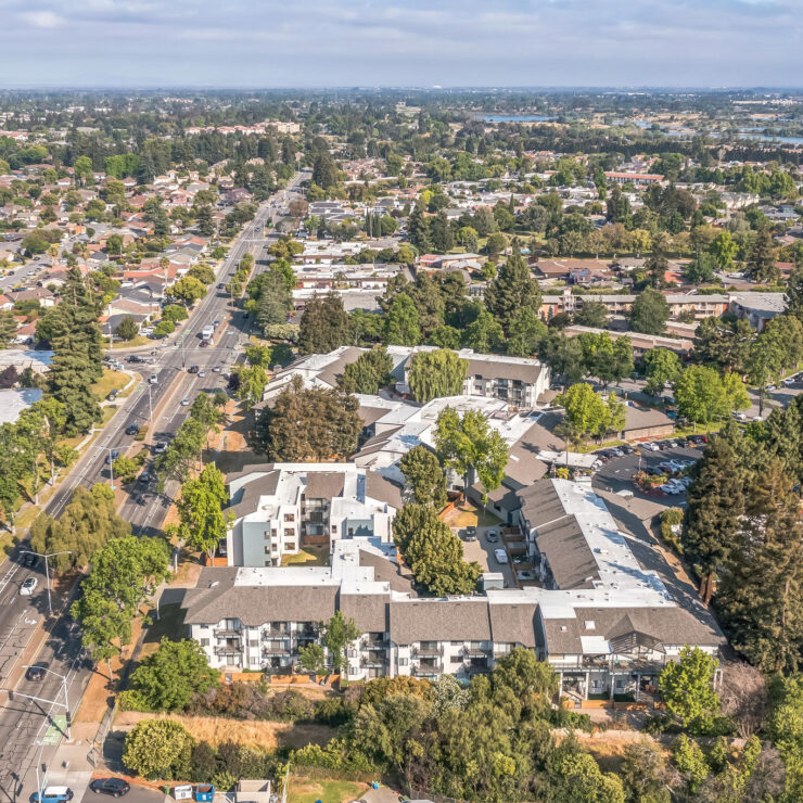 A welcoming community surrounded by greenery, offering a serene atmosphere for residents to thrive.