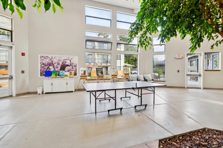 A bright, inviting space filled with natural light, featuring comfortable seating and engaging activities.