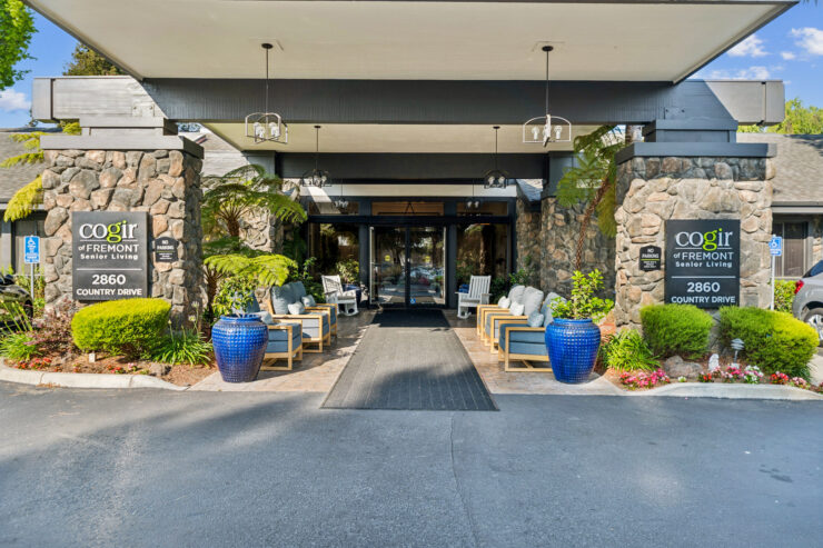 Welcoming entrance with vibrant greenery and comfortable seating, fostering a sense of community.