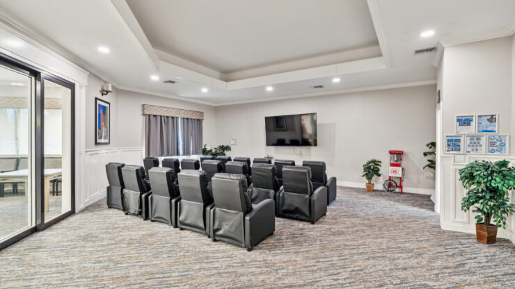 A welcoming lounge featuring comfortable seating, perfect for community gatherings and entertainment.
