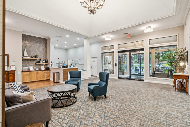 A welcoming lounge area with comfortable seating, inviting community interactions, and bright natural light.