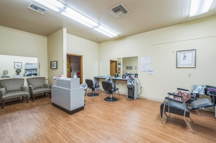 A welcoming salon space designed for relaxation and community, perfect for residents to enjoy.