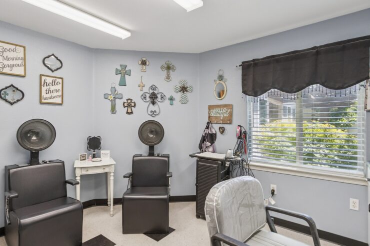 A welcoming salon space adorned with decorative crosses, promoting relaxation and community connection.
