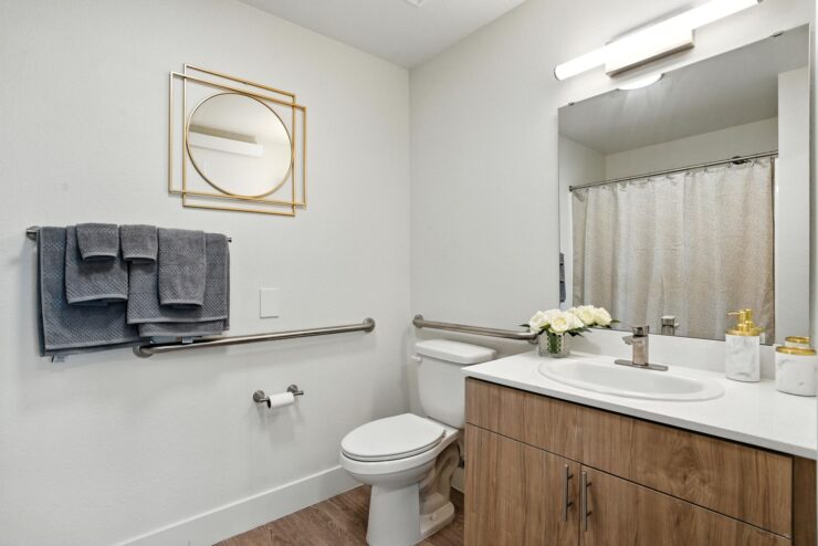 A bright, inviting bathroom featuring elegant fixtures and thoughtful touches for comfort and ease.