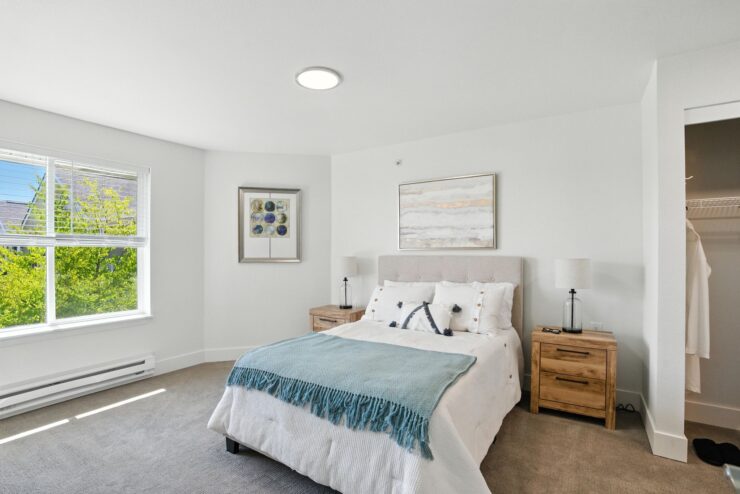 Bright, inviting bedroom with serene decor, fostering a sense of community and comfort.