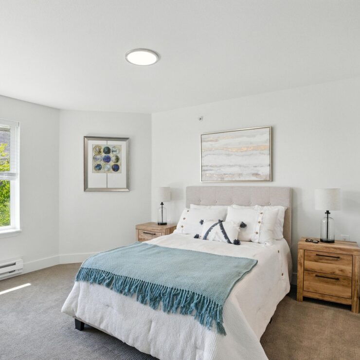 Bright, inviting bedroom with serene decor, fostering a sense of community and comfort.