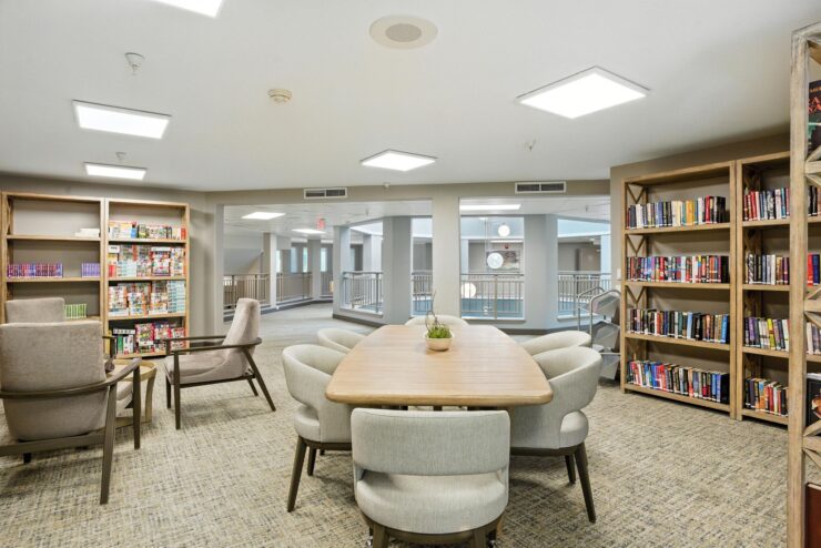 A welcoming library space with comfortable seating, inviting bookshelves, and natural light, perfect for community gatherings.