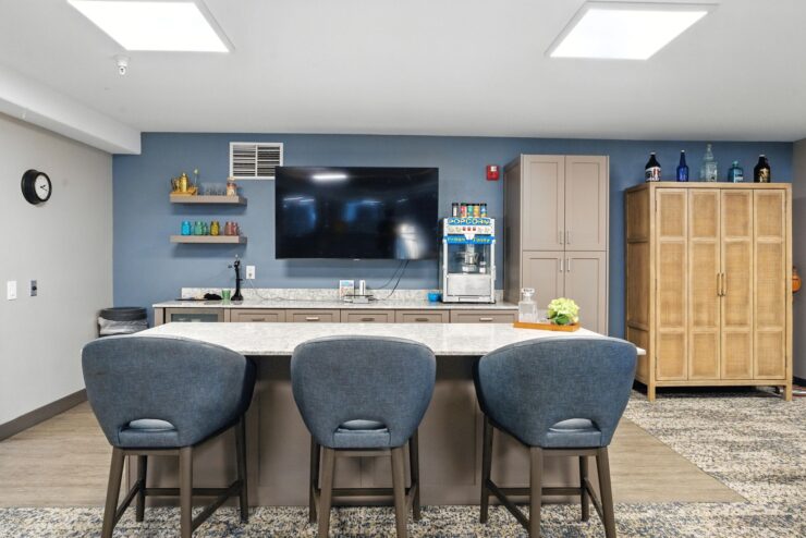 A welcoming lounge features modern decor, cozy seating, and a vibrant atmosphere for community gatherings.