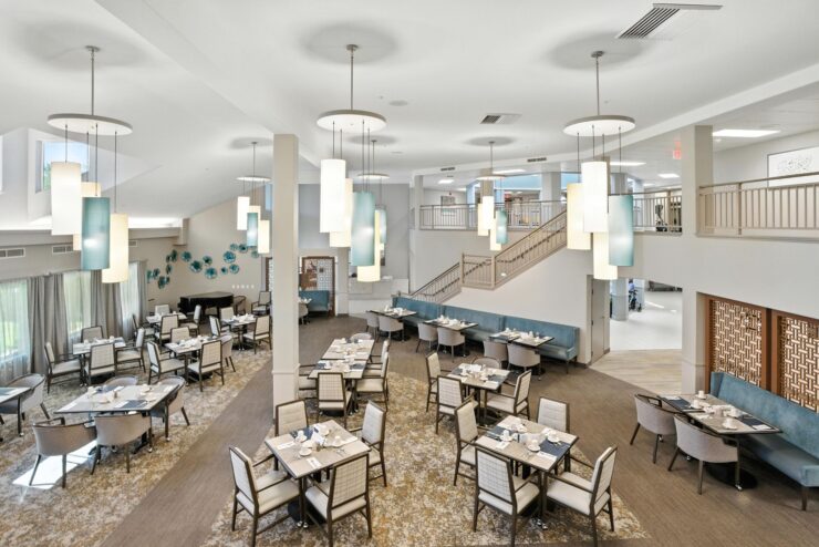 A welcoming dining area filled with light, offering a warm atmosphere for community gatherings.