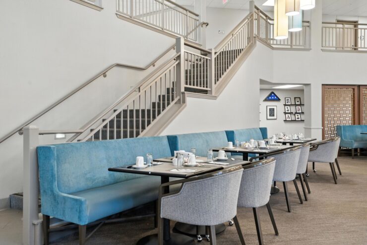 A welcoming dining area featuring comfortable seating and a bright, inviting atmosphere for community gatherings.