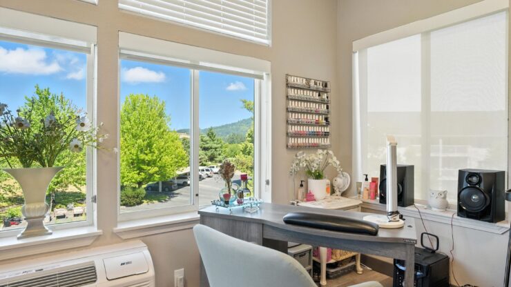 Bright, airy workspace with scenic views, fostering a sense of community and comfort for residents.