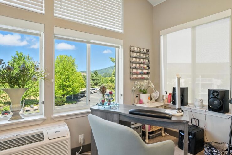 Bright, airy workspace with scenic views, fostering a sense of community and comfort for residents.