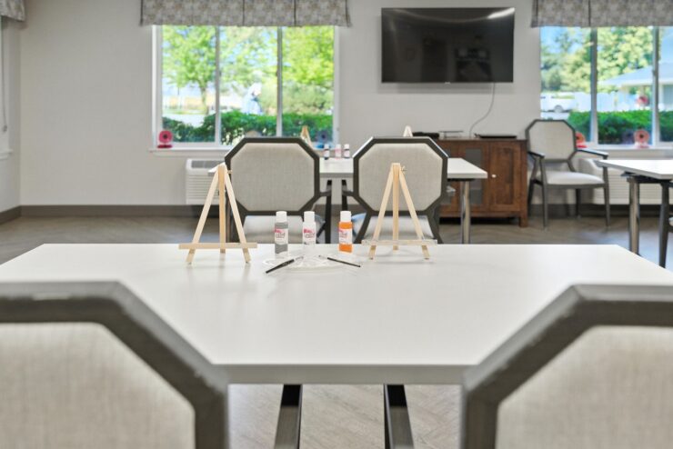 A welcoming activity area with art supplies invites creativity and fosters community engagement.