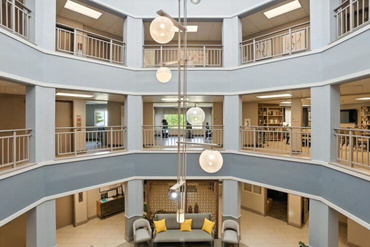 Bright, inviting common area fosters community and comfort, featuring stylish seating and natural light.