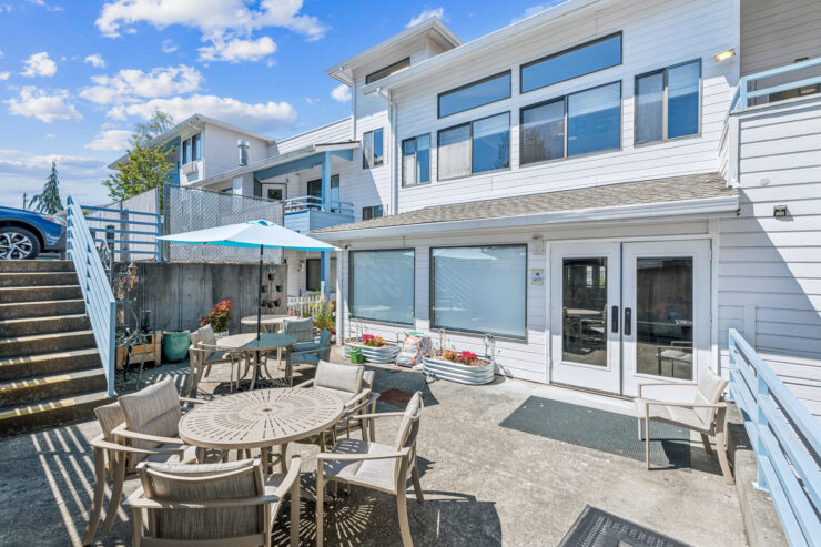 A welcoming outdoor space with comfortable seating invites community gatherings and relaxation.