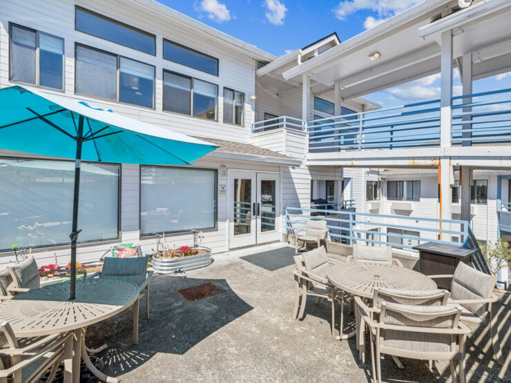 A welcoming outdoor space with comfortable seating, perfect for community gatherings and relaxation.