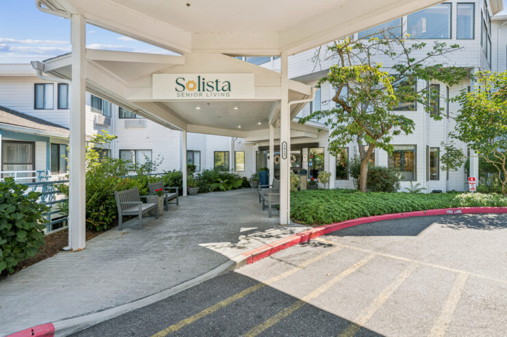 A welcoming entrance surrounded by greenery, inviting residents and visitors to a vibrant community.