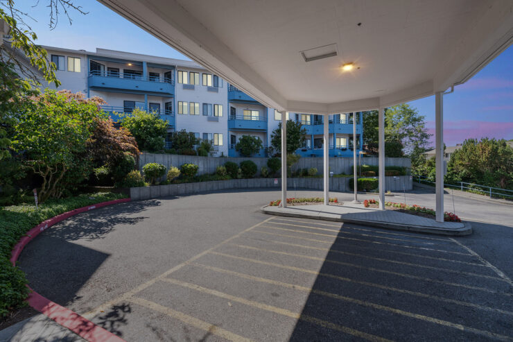 A welcoming entrance surrounded by greenery, inviting residents to enjoy a vibrant community atmosphere.