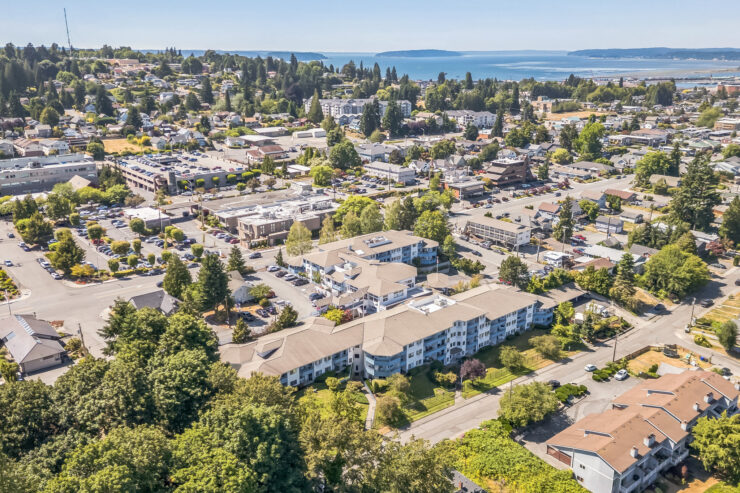 A vibrant community nestled among lush greenery, offering a serene atmosphere and beautiful views.