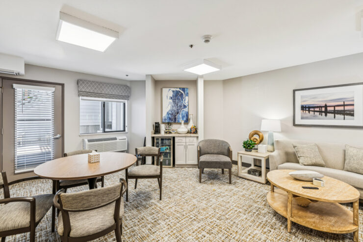 A welcoming common area with comfortable seating, inviting decor, and natural light fosters connection.