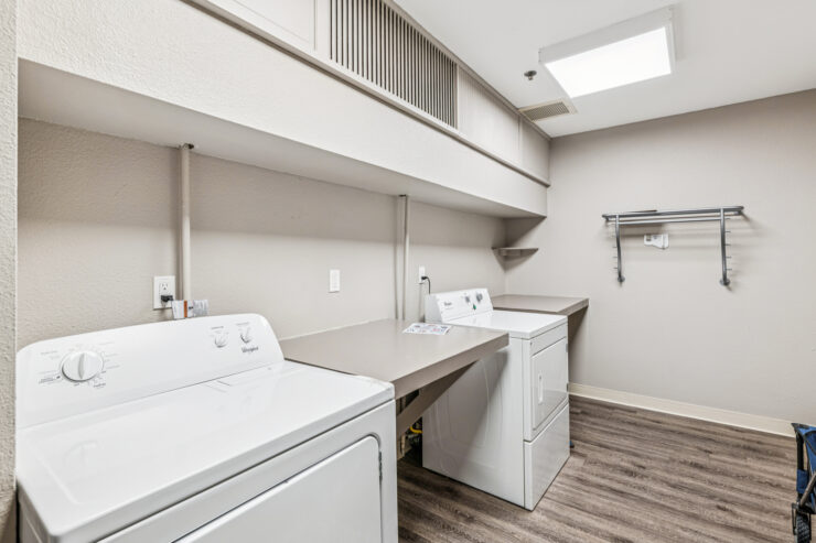 Bright and inviting laundry room designed for convenience and community comfort.