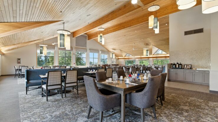 Bright, inviting dining area with spacious seating, perfect for community gatherings and shared meals.
