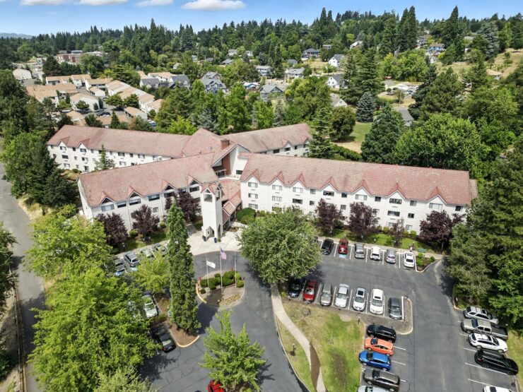 A welcoming retirement community surrounded by greenery, offering comfort and connection for all residents.