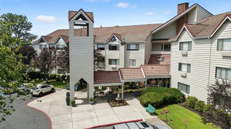 A welcoming community hub, featuring beautiful gardens and a charming entrance, perfect for gatherings.