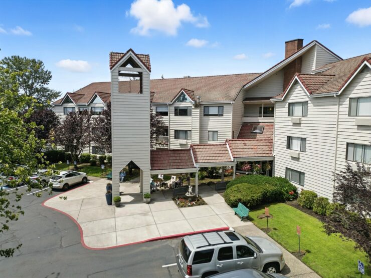 A welcoming community hub, featuring beautiful gardens and a charming entrance, perfect for gatherings.